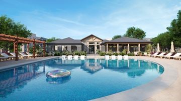 Greenville apartment for rent - A large swimming pool with a floating chair in the middle.