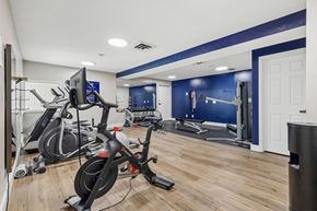Cincinnati apartment for rent - A gym with a row of stationary bikes.