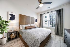 Rock Hill apartment for rent - a bedroom with a bed and a ceiling fan