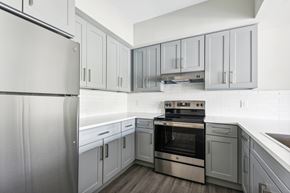Goose Creek apartment for rent - A modern kitchen with a stainless steel refrigerator and oven.
