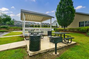Smyrna apartment for rent - A picnic area with a table and a trash can.