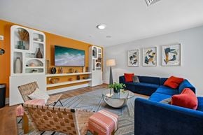 Columbus apartment for rent - A living room with a blue couch and a coffee table.