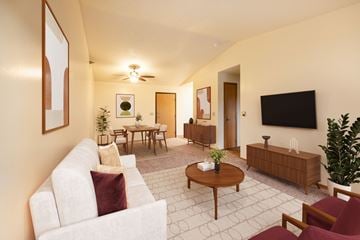Urbandale apartment for rent - A living room with a white couch and a wooden coffee table.