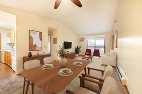 Urbandale apartment for rent - A dining room with a wooden table and chairs.