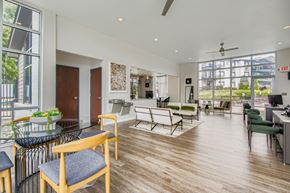 Nashville apartment for rent - A modern office space with wooden floors and furniture.