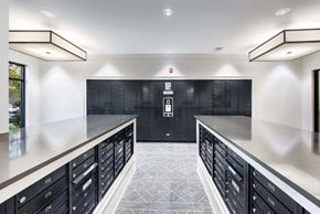 Suwanee apartment for rent - a large kitchen with a long counter top and black cabinets