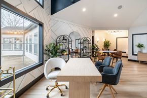 Lexington apartment for rent - A modern dining room with a long table and chairs.