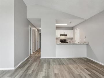 Springdale apartment for rent - A kitchen with a white counter and wooden floors.