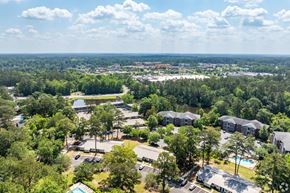 Thomasville apartment for rent - an aerial view of a park with buildings and trees