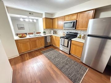 Lebanon apartment for rent - A kitchen with wooden cabinets and stainless steel appliances.