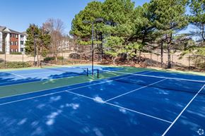 Acworth apartment for rent - two tennis courts with trees in the background on a sunny day