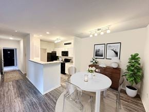 Columbus apartment for rent - A modern kitchen with a dining table and chairs.