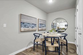 Punta Gorda apartment for rent - a dining area with a round table and blue chairs