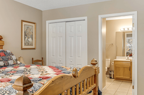 Asheville apartment for rent - A bedroom with a bed, dresser, and mirror.