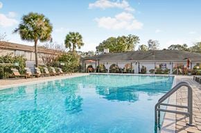 Savannah apartment for rent - A large swimming pool with a metal railing on the side.