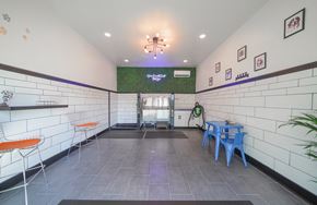 Destin apartment for rent - a dining room with a table and chairs and a chandelier hanging from the ceiling