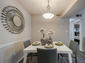 Atlanta apartment for rent - A dining room with a white table and chairs.