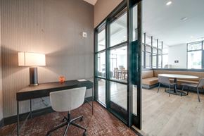 Rock Hill apartment for rent - a conference room with glass doors and a desk with a chair