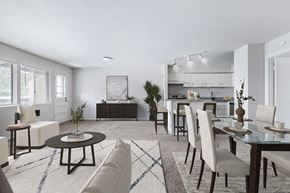 Prairie Village apartment for rent - A modern dining room with a glass table and chairs.