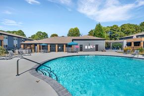 Doraville apartment for rent - a resort style pool with a building in the background