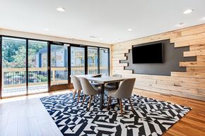 Decatur apartment for rent - a dining room with a table and chairs and a television