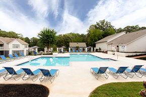 Stockbridge apartment for rent - our apartments have a resort style pool with blue chairs at Magnolia Place at Stockbridge Apartments, Stockbridge, GA