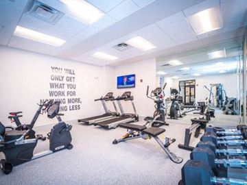 Clermont apartment for rent - a gym with a lot of exercise equipment in it
