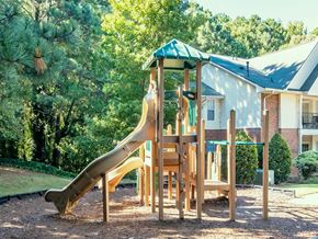 Canton apartment for rent - A wooden playground slide in a residential area.