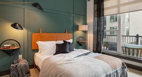 Chamblee apartment for rent - a bedroom with a bed and a large window
