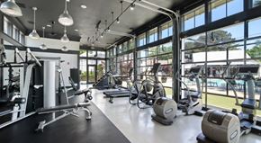 Columbus apartment for rent - A gym with a variety of equipment including treadmills, weights, and exercise machines.