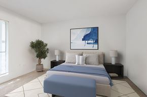 Columbia apartment for rent - A bedroom with a large bed and a painting on the wall. at Grove at St. Andrews, Columbia, SC, 29210