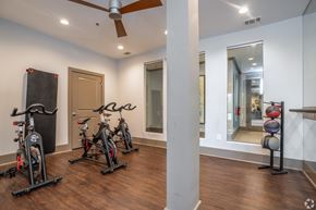 Atlanta apartment for rent - A room with a wood floor and a ceiling fan.