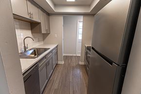 Georgetown apartment for rent - A kitchen with a refrigerator on the right.