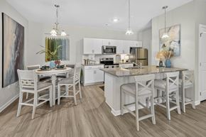 Summerville apartment for rent - A kitchen with a table and chairs in front of it.