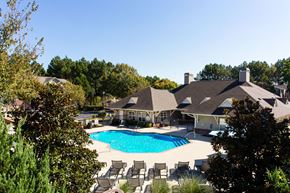 Gainesville apartment for rent - a large swimming pool in front of a house at Indigo Apartments Gainesville, Gainesville, GA 30504