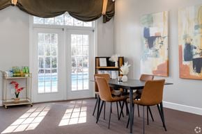 Acworth apartment for rent - a dining room with a table and chairs and a window
