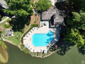 Greensboro apartment for rent - an aerial view of a swimming pool in the backyard of a house