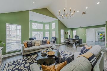 Houston apartment for rent - A living room with a grey couch and a coffee table.