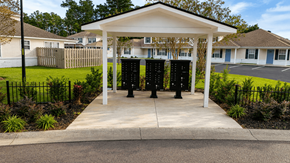Moncks Corner apartment for rent - A white pavilion with a black pole in front of a building.