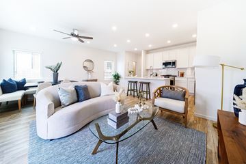 Rosharon apartment for rent - A living room with a white couch and a coffee table.
