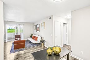 Shawnee Mission apartment for rent - A living room with a white couch and a black coffee table.