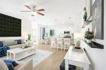 Summerville apartment for rent - A modern living room with a white sofa and a white coffee table.