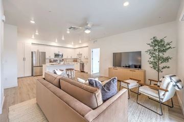 Las Vegas apartment for rent - A living room with a brown couch and a television.
