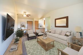 Grimes apartment for rent - A living room with a couch, chairs, and a coffee table.