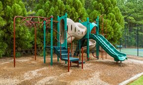 Lawrenceville apartment for rent - Overlook at Gwinnett Stadium Playground featuring slides. Lawrenceville, GA.