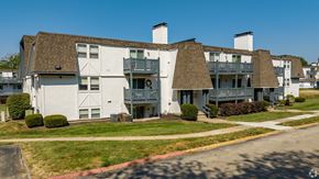 Shawnee Mission apartment for rent - a view of the exterior of a building at the whispering winds apartments in pearland