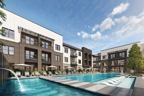 Euless apartment for rent - A modern apartment complex with a pool in the foreground.