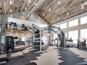 Indian Land apartment for rent - a gym with exercise equipment and large windows