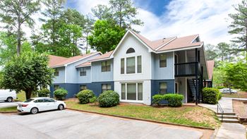 Two story building with landscaped front lawn