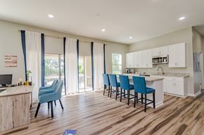 East Ridge apartment for rent - a kitchen and living room with a sliding glass door leading to a patio at Summit East Ridge, East Ridge Tennessee